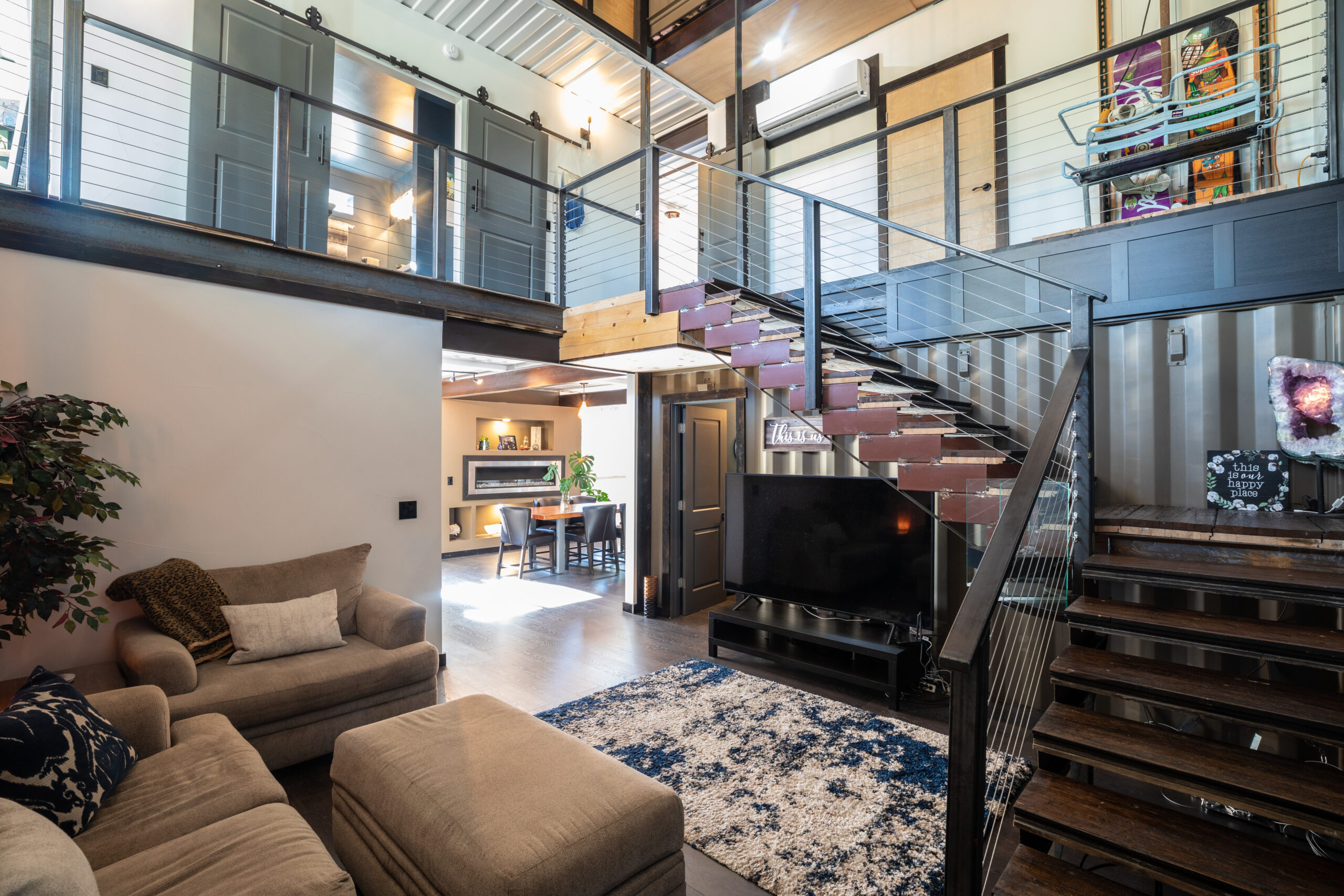 Custom interiors combine warm living spaces with exposed steel.